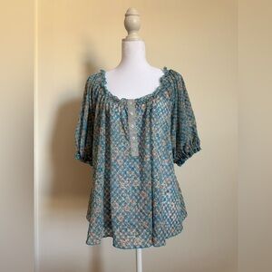 NWT women’s free people top size Large peasant style in blue pattern